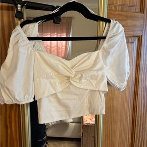 White off the shoulder cropped top, puff sleeve. Brand Elodie size XS